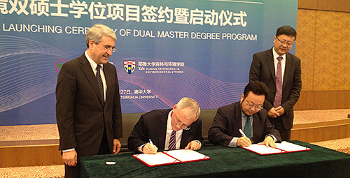 Officials from Yale University and Tsinghua University sign the Memorandum of Understanding on Oct. 27 in Beijing. Seated, from left, Yale F&ES Dean Peter Crane and Tsinghua SOE Dean He Kebin; standing, from left, Yale President Peter Salovey and Tsinghua President Chen Jining.