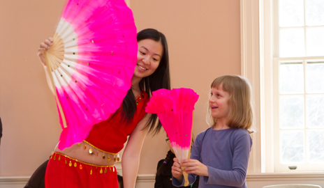 A member of the Yale Phoenix Dance Troupe teaches a popular modern interpretation of ancient fan dance during last year's celebration at the New Haven Museum. (Photo courtesy of the Yale-China Association)