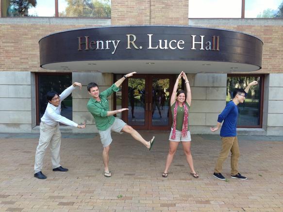 Students posing to spell CEAS during the Fall Welcome Reception