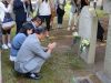 Laying flowers in front of Professor Asakawa’s headstone